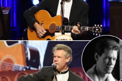 Three years after suffering a massive stroke that nearly stole his voice forever, Randy Travis stepped onto the stage, determined to do what he was born to do. With nothing but a guitar and his voice, he began to sing Amazing Grace—and in that moment, time stood still. The crowd, once buzzing with excitement, fell into complete silence, hanging onto every fragile, yet powerful note. Each word carried the weight of his journey, each sound a testament to his resilience. By the end, there wasn’t a dry eye in the house. A legend had returned, and his golden voice still held the power to move souls.